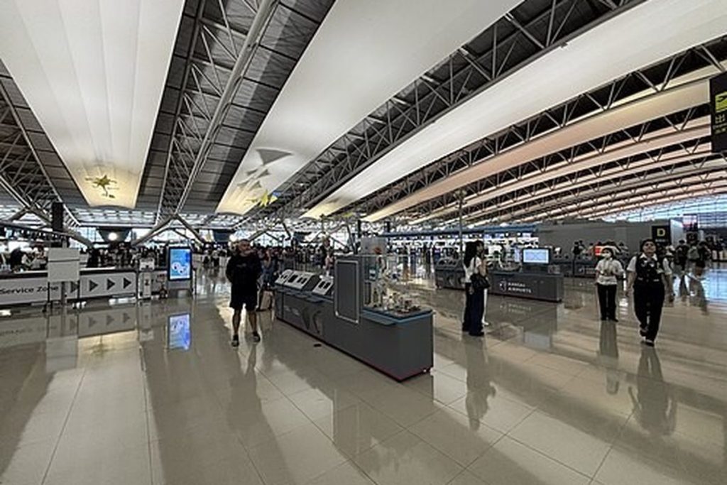 Kansai Airport Terminal 1 departure hall with its curved roof and check-in islands