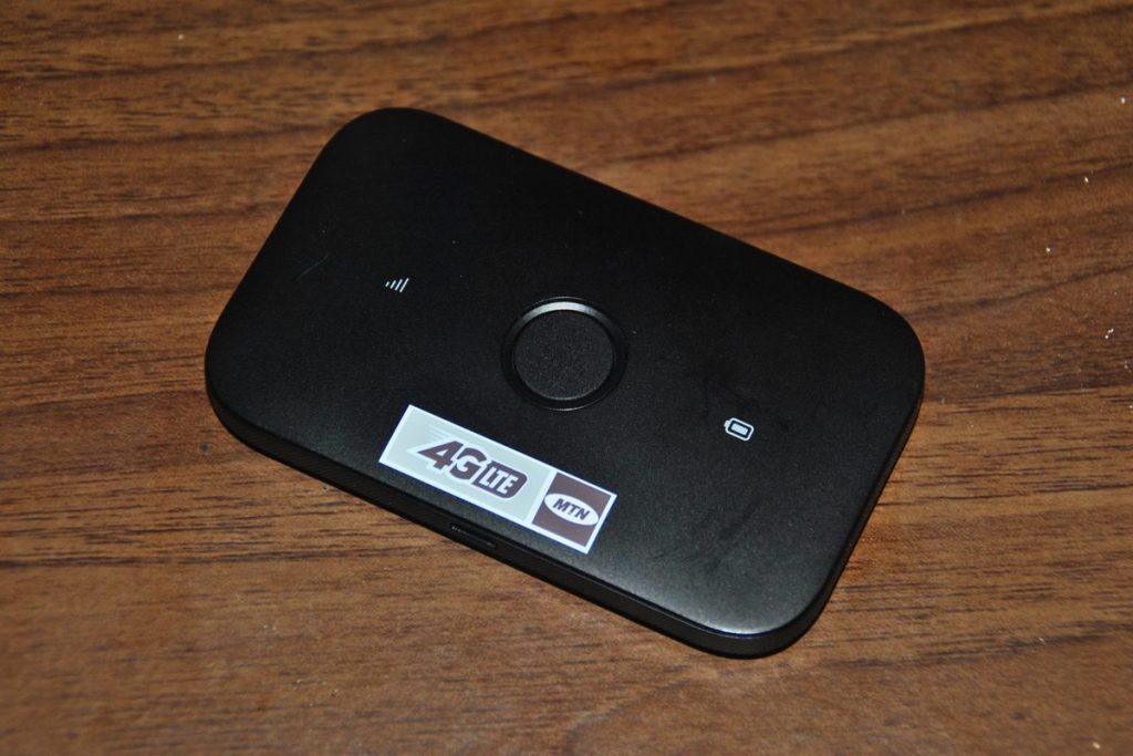A black battery-powered pocket Wi-Fi router, the kind of device rented for a Japan trip