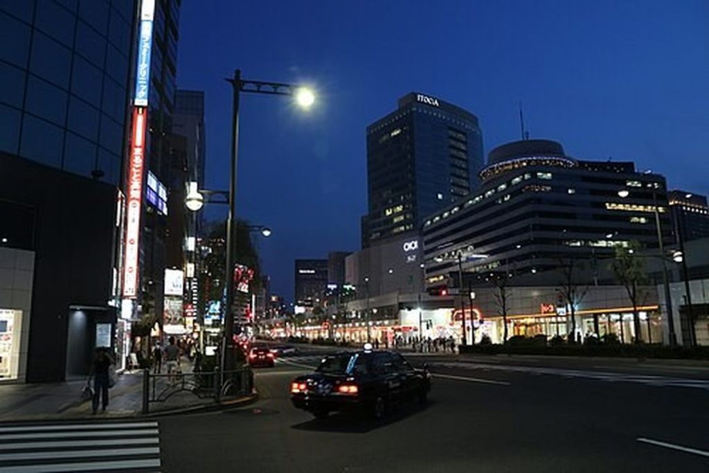 Taxi driving on a quiet central Tokyo street at night