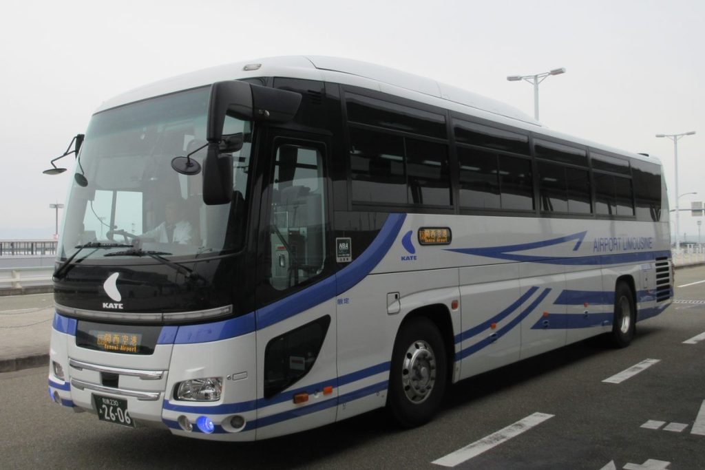 White and blue Kansai Airport limousine coach parked at Kansai International Airport