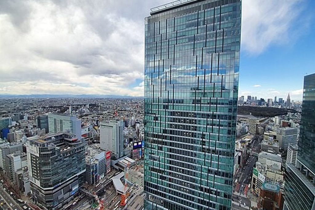 Glass tower of Shibuya Scramble Square rising above the Shibuya Station area